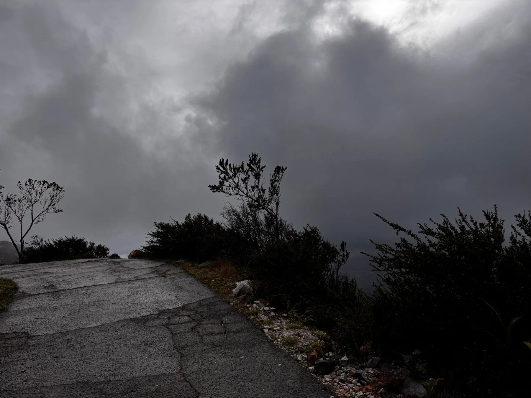 Dark clouds above the mountain path